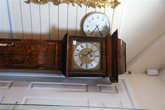 Sam Macham of London. A William and Mary mulberry cased eight-day longcase clock, 7ft. 2in. (plinth altered, parts replaced)